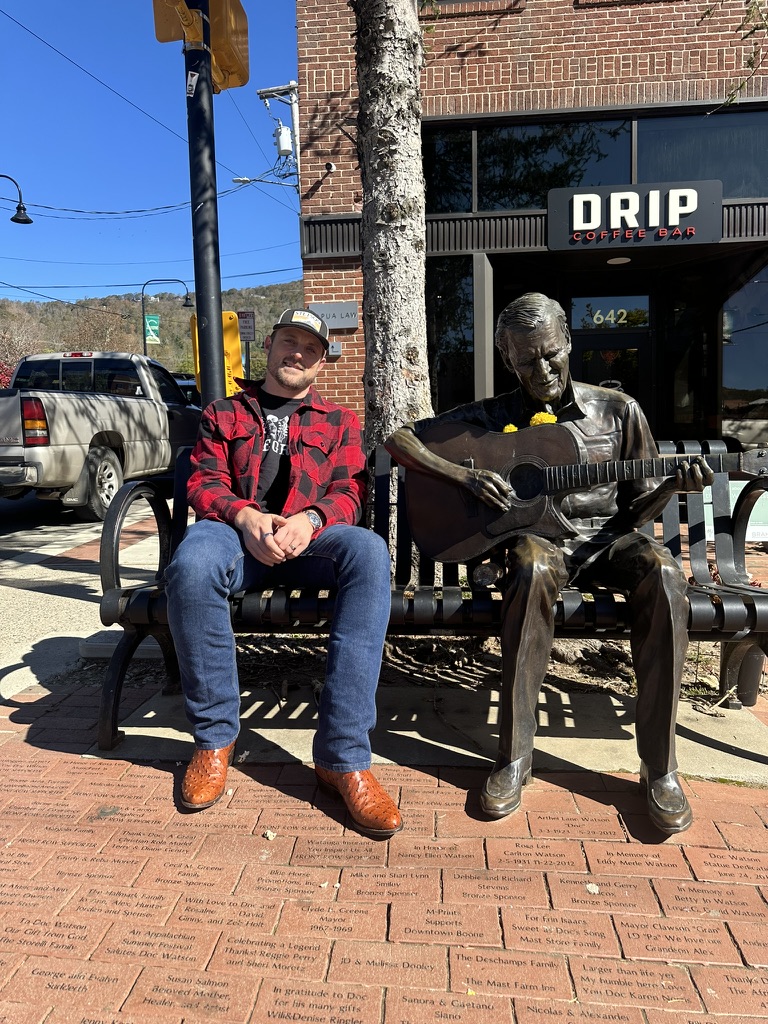 With the Doc Watson statue